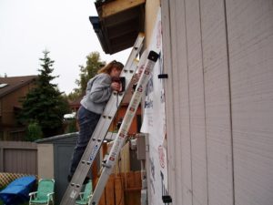 Melissa sleeping on a ladder